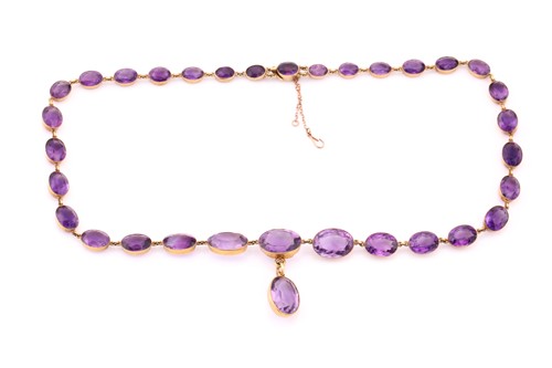 Lot 150 - An amethyst riviere necklace, early 20th...