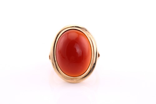 Lot 53 - A carnelian cabochon ring, mid 20th century,...