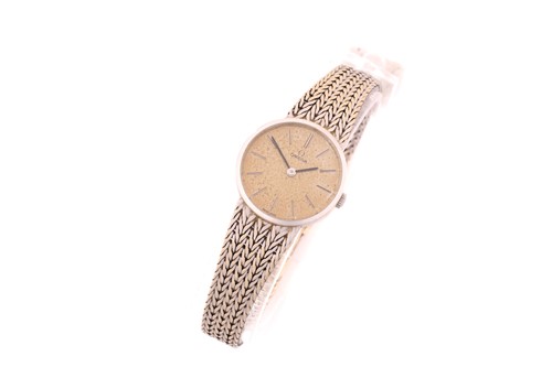 Lot 554 - A lady's hand-wound Omega 7283 with 23mm case...