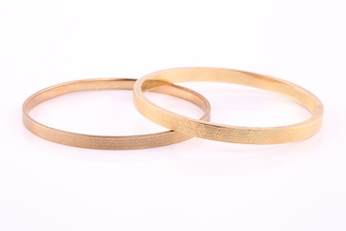 Lot 451 - Two gold bangles comprising of a 15ct hollow...