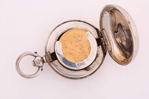 Lot 474 - A 1914 George V full sovereign in a silver...