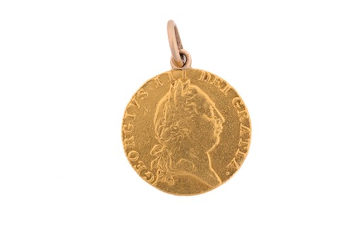 Lot 467 - A George III guinea, with crowned spade shield,...