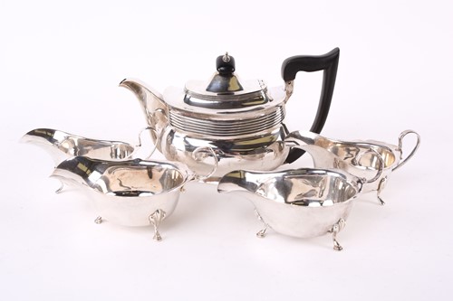Lot 589 - A George III silver teapot of pot-bellied...