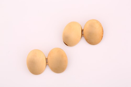 Lot 26 - A pair of 18ct gold cufflinks, of plain oval...