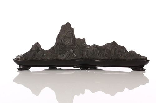 Lot 111 - A Chinese carved and part polished stone brush...