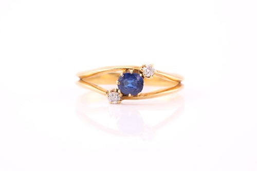 Lot 332 - A sapphire and diamond three stone ring,...