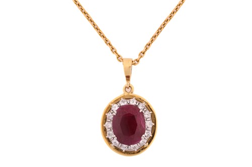 Lot 63 - A ruby entourage converted pendant on chain,...