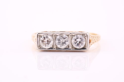 Lot 467 - A three-stone diamond panel ring, consisting...