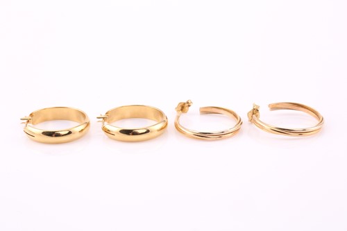 Lot 298 - A lot consists of two pairs of hooped earrings....