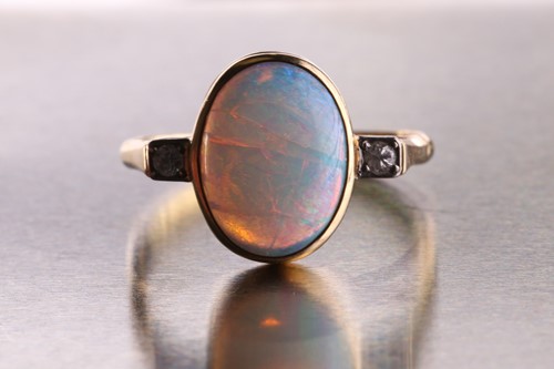 Lot 362 - An opal and diamond ring, consisting of an...