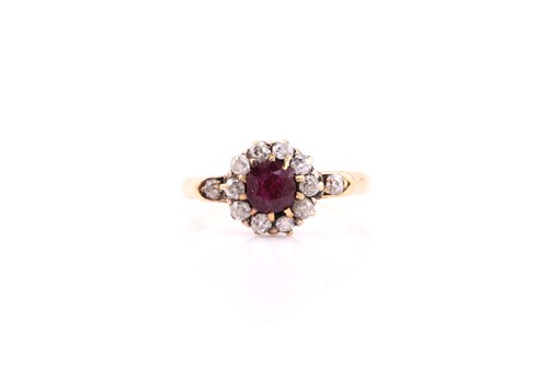 Lot 439 - A ruby and diamond cluster ring, consisting of...
