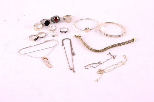 Lot 121 - A Tiffany and Co. silver bangle with a hidden...