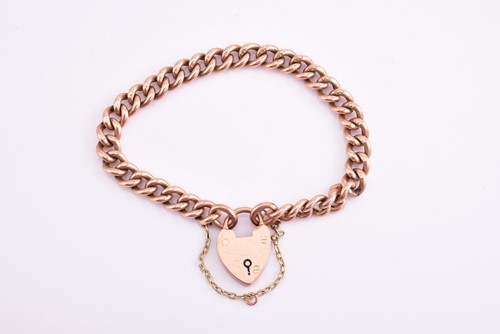 Lot 348 - A 9ct rose gold curb link bracelet with...