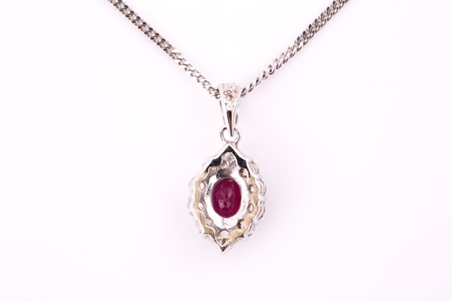 Lot 383 - An 18ct white gold ruby and diamond cluster...