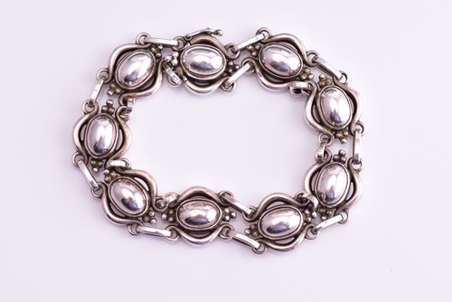 Lot 11 - Georg Jensen - an oval cabochon and scroll...