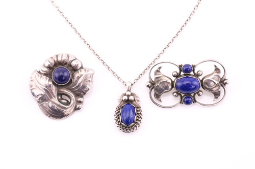 Lot 9 - Georg Jensen - a floral brooch centred by a...