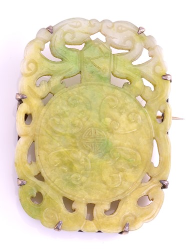 Lot 374 - A carved jade panel brooch of rectangular...