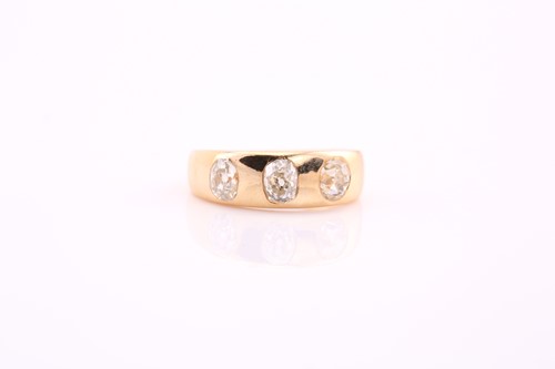 Lot 68 - An old cut diamond set three stone gypsy ring,...