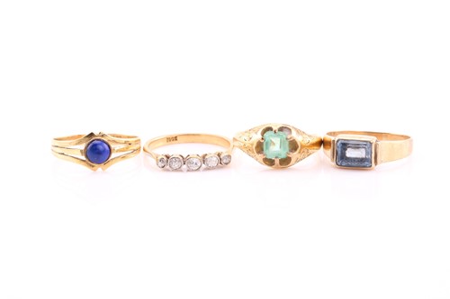 Lot 381 - A lot consisting of four rings, a graduated...