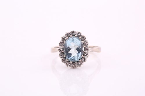 Lot 36 - An aquamarine and diamond cluster ring, the...