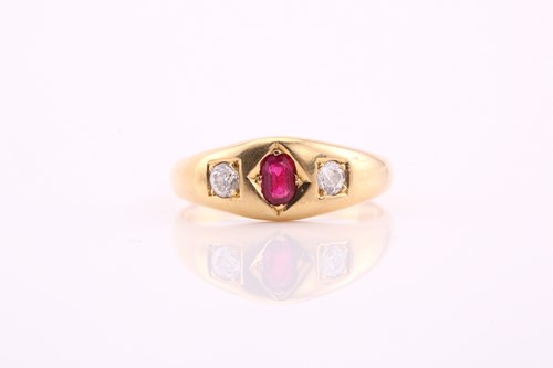 Lot 402 - A three stone ruby and diamond ring,...
