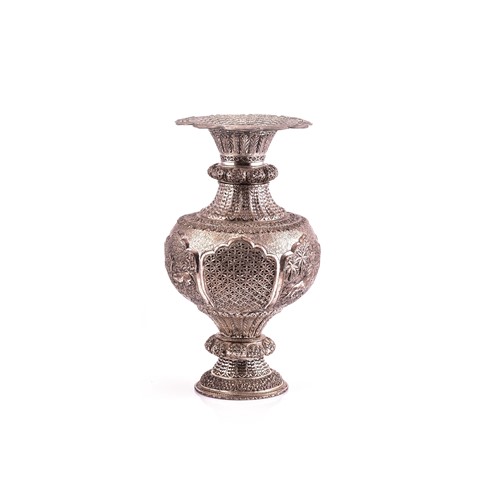 Lot 535 - A large Persian white metal vase, embossed...
