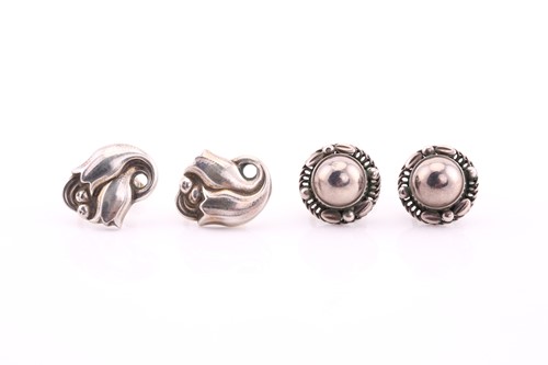 Lot 17 - Georg Jensen - a pair of foliate scroll...