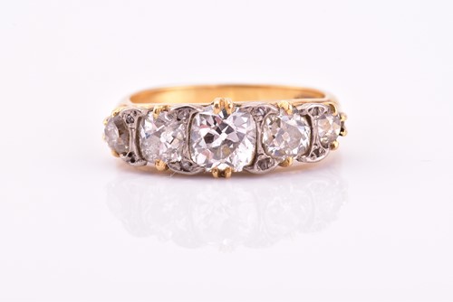 Lot 198 - A yellow gold and five stone diamond dress...