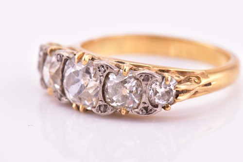 Lot 198 - A yellow gold and five stone diamond dress...