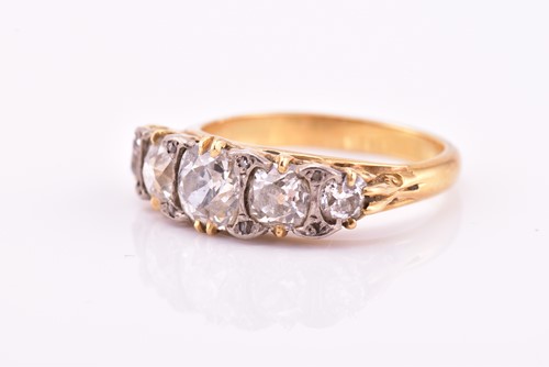 Lot 198 - A yellow gold and five stone diamond dress...
