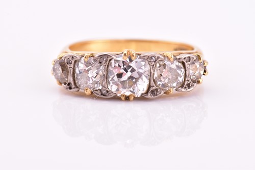 Lot 198 - A yellow gold and five stone diamond dress...