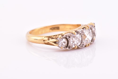 Lot 198 - A yellow gold and five stone diamond dress...