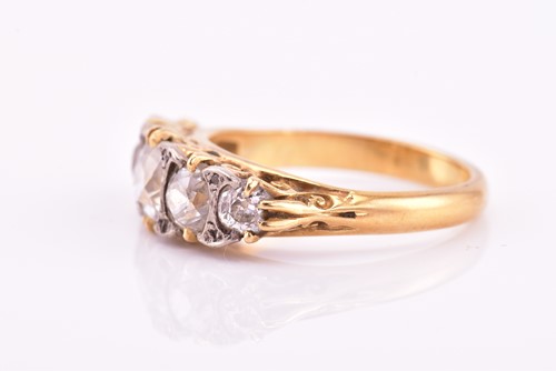 Lot 198 - A yellow gold and five stone diamond dress...