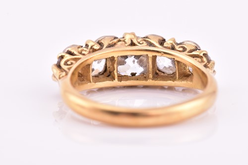 Lot 198 - A yellow gold and five stone diamond dress...