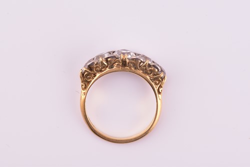 Lot 198 - A yellow gold and five stone diamond dress...
