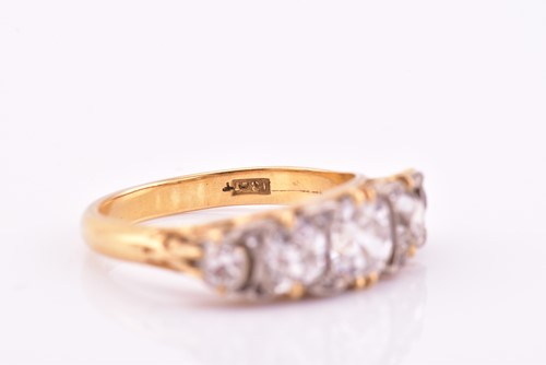 Lot 198 - A yellow gold and five stone diamond dress...