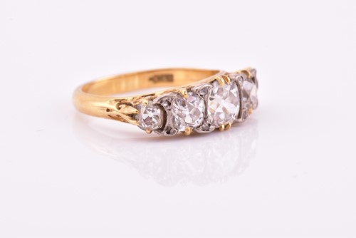 Lot 198 - A yellow gold and five stone diamond dress...