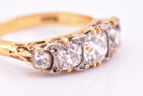 Lot 198 - A yellow gold and five stone diamond dress...