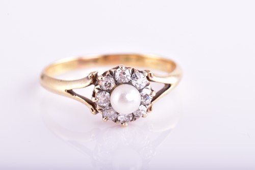 Lot 441 - A pearl and diamond cluster ring; the central...