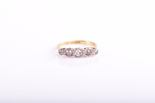 Lot 338 - A five stone half hoop diamond ring, the mixed...