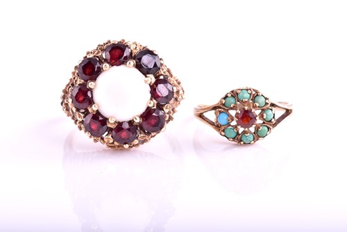 Lot 403 - A large opal and garnet circular cluster ring,...