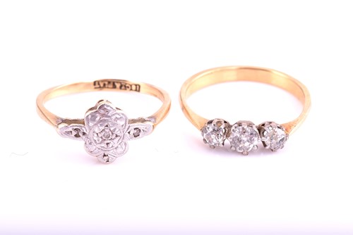 Lot 334 - A three stone half hoop diamond ring, the...