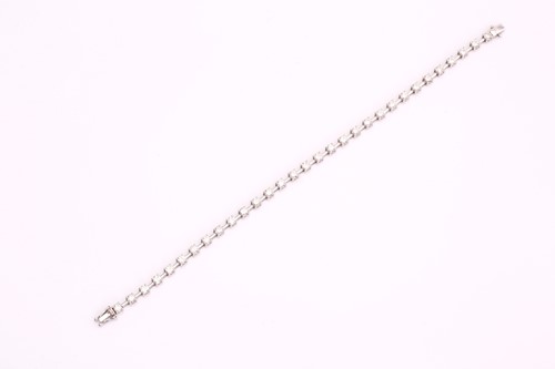 Lot 150 - A diamond tennis bracelet, consisting of 31...