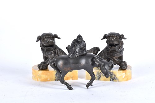 Lot 152 - A Chinese bronze figure of a man upon a water...
