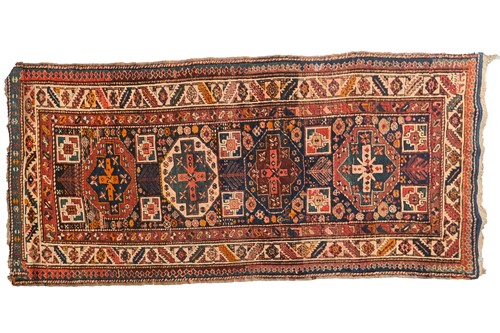 Lot 283 - An indigo blue ground Karachov Kazak long rug,...