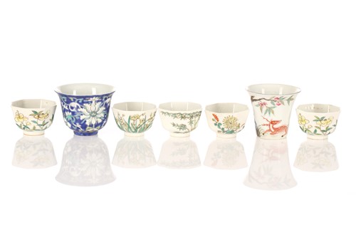 Lot 268 - A Chinese porcelain bell shape wine cup,...