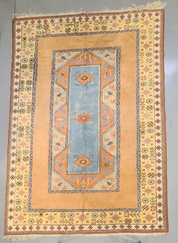 Lot 404 - A peach ground Turkish Milas carpet, 20th...