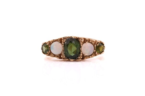 Lot 23 - A tourmaline and opal dress ring, comprises a...