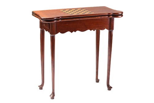 Lot 277 - A George III style oak fold-over gaming table...