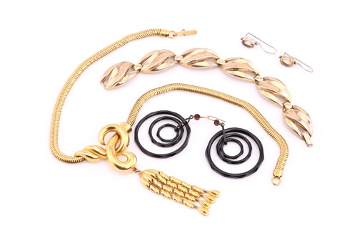 Lot 180 - A pair of jet pendant earrings; composed of...